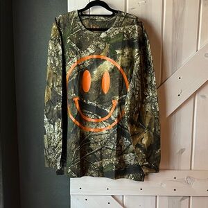 Dressed in LALA The World Needs
Your Magic Oversized Long Sleeve Tee in Camo